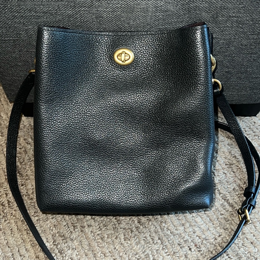 Coach Charlie in black